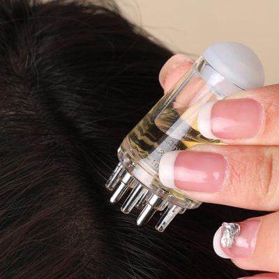 Microneedling serum application on scalp for hair growth at Monalisa Store, specializing in advanced hair restoration treatments and dermatologist-approved scalp therapy solutions.