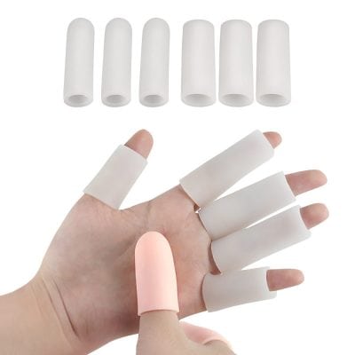 Silicone finger protectors for nail extensions or gel nails, used in beauty salons for precise nail application and protection during manicures.