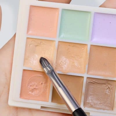 Color correction makeup palette with pastel shades and concealer colors for skincare and cosmetic purposes.