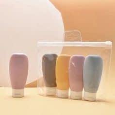 Pink and black solid skincare bottles, colorful and modern design for dermatology or beauty treatments.