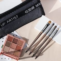 Bright eye makeup brushes and eyeshadow palette in a stylish makeup kit at Monalisa Store for professional or personal cosmetics routines.