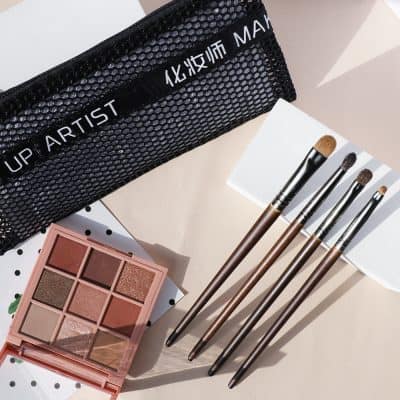 Bright eye makeup brushes and eyeshadow palette in a stylish makeup kit at Monalisa Store for professional or personal cosmetics routines.