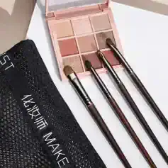 Vegan eyeshadow palette with neutral tones and three makeup brushes on white background at Monalisa Store. Perfect for creating natural eye makeup looks.