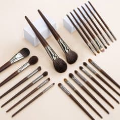 High-quality wooden makeup brushes with synthetic bristles, various sizes, and professional-grade tools for blending, contouring, and eye makeup applications at Monalisa Store.