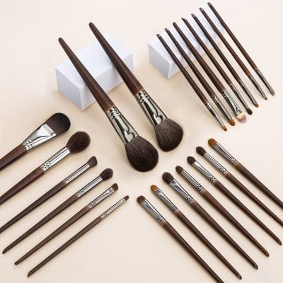 High-quality wooden makeup brushes with synthetic bristles, various sizes, and professional-grade tools for blending, contouring, and eye makeup applications at Monalisa Store.