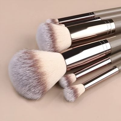 Luxurious makeup brushes with soft bristles and sleek metallic handles, ideal for professional beauty and cosmetic application. Perfect for achieving a flawless makeup look.
