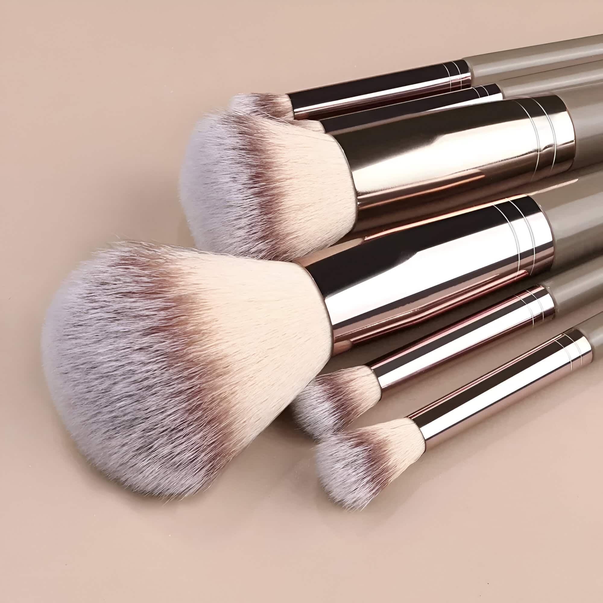 Luxurious makeup brushes with soft bristles and sleek metallic handles, ideal for professional beauty and cosmetic application. Perfect for achieving a flawless makeup look.
