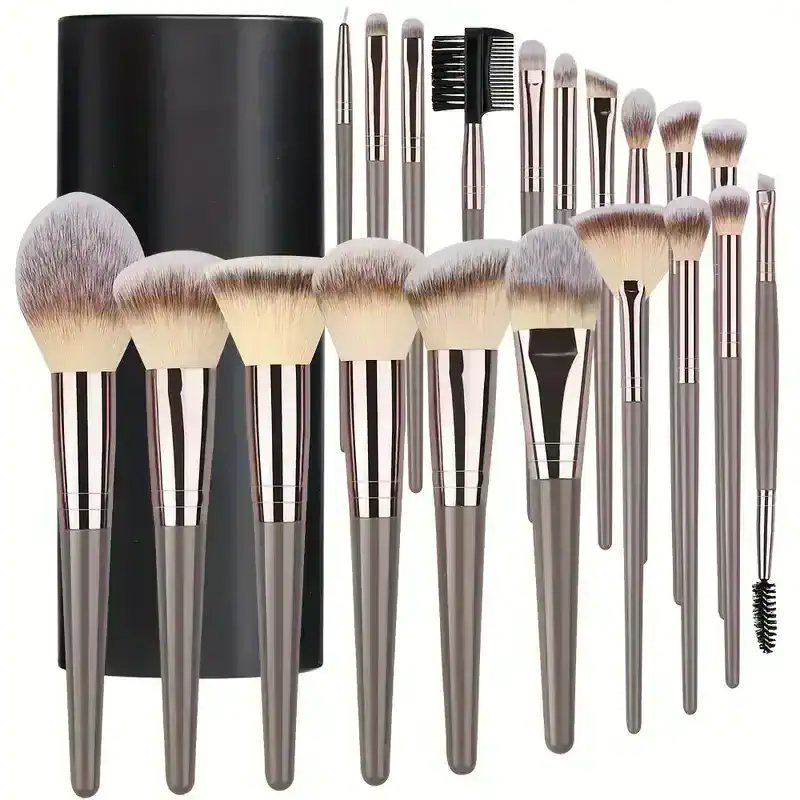 Brush set with makeup brushes and tools in silver handles, ideal for professional cosmetic applications. High-quality bristles designed for flawless makeup application. Perfect for beauty enthusiasts and makeup artists.