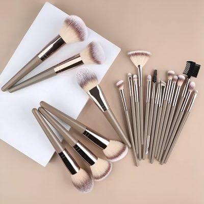 Luxurious makeup brushes with soft bristles on a beige background, perfect for professional or everyday makeup application, emphasizing quality and beauty tools.