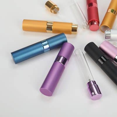 Colorful cosmetic spray bottles for skincare and beauty products, diverse array of portable containers for serums, perfumes, and essential oils, ideal for personal care and professional use at Monalisa Store.