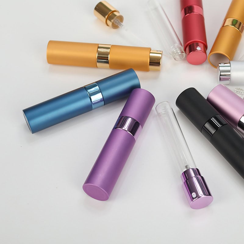 Colorful cosmetic spray bottles for skincare and beauty products, diverse array of portable containers for serums, perfumes, and essential oils, ideal for personal care and professional use at Monalisa Store.