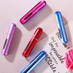 Colorful portable skincare devices for facial treatments, in pink, purple, red, and blue metallic finishes, ideal for beauty routines and skin rejuvenation at Monalisa Store.