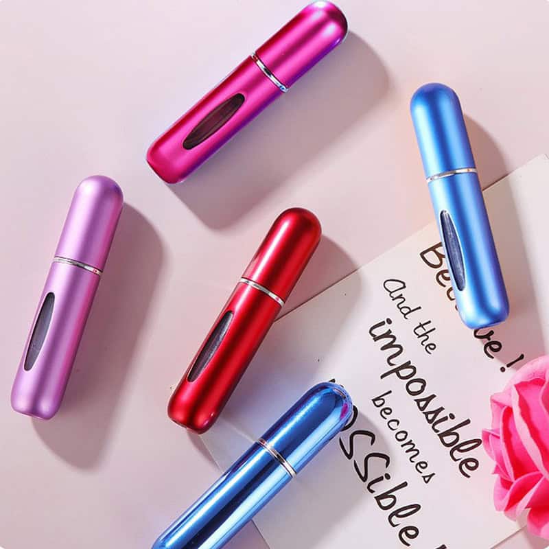 Colorful portable skincare devices for facial treatments, in pink, purple, red, and blue metallic finishes, ideal for beauty routines and skin rejuvenation at Monalisa Store.