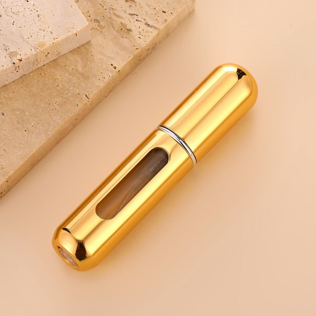 Elegant gold and black handheld beauty device with a sleek design, ideal for skincare treatments and facial massage at Monalisa Medical Store.