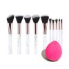 Brush set for makeup application with a marble design handle and a pink beauty blender sponge, ideal for professional and everyday cosmetic use.