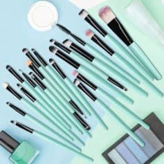 Professional makeup brushes set with mint green handles and black ferrules, including eyeshadow brushes, blending brushes, and sponges, ideal for beauty enthusiasts and makeup artists at Monalisa Store.