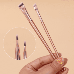 Soft pink makeup brushes set with synthetic bristles for eye and face makeup application, includes angled and flat brushes, perfect for professional or personal use.
