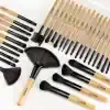 High-quality makeup brushes set with natural wood handles and black synthetic bristles, ideal for professional and everyday cosmetics application. Perfect for eyes, face, and contour makeup routines.