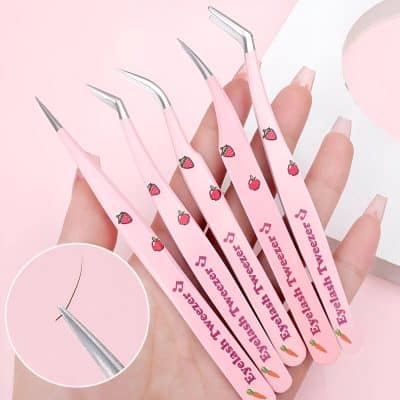 Pink eyelash extension tools with strawberry, cherry, and carrot designs, ideal for eyelash extensions and lash lifting, featured at Monalisa Store for professional beauty treatments.