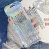 Miniature makeup brushes set in iridescent packaging, perfect for precise beauty application and skincare routines. Ideal for cosmetics enthusiasts and professional artists.