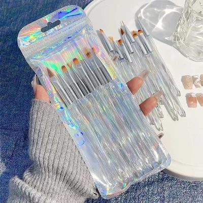 Miniature makeup brushes set in iridescent packaging, perfect for precise beauty application and skincare routines. Ideal for cosmetics enthusiasts and professional artists.