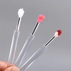 White and pink cosmetic swabs with soft fibers for beauty and skincare used in cosmetics and medical applications.