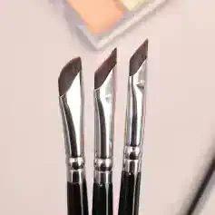 Brush set for eyebrow and eyelash styling, professional precision makeup tools, curved design for detailed application, high-quality stainless steel brushes for beauty salons, Monalisa Store opt options for makeup artists.