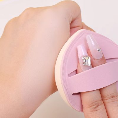 Ceramic nail remover with a pink silicone handle, used for gentle removal of gel and acrylic nails.