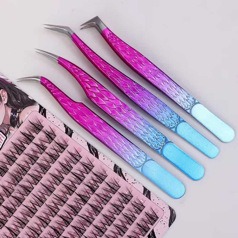 Pink and purple eyelash extension tweezers with a mermaid scale pattern, designed for precise eyelash application at Monalisa Store.