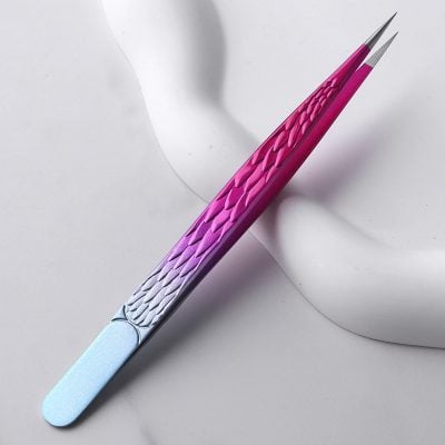 Pink and purple textured cuticle pusher with metallic tip for precise nail care, ideal for professional and at-home manicure and pedicure routines.