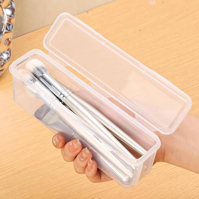 Clear plastic storage case with makeup brushes inside, ideal for organizing beauty tools at Monalisa Store.