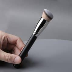 Professional makeup brush with sleek black handle and soft bristles, ideal for cosmetics application, featured on Monalisa Medical Store website.