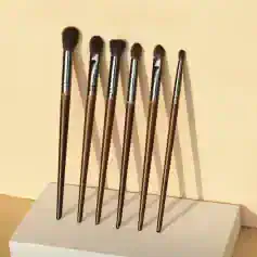 Soft makeup brushes displayed on a white stand, ideal for professional and everyday beauty applications, perfect for creating flawless makeup looks.