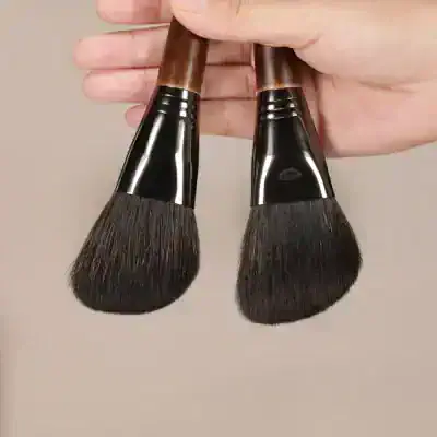 Luxurious makeup brushes with wooden handles and soft bristles, ideal for professional or personal beauty applications at Monalisa Store.