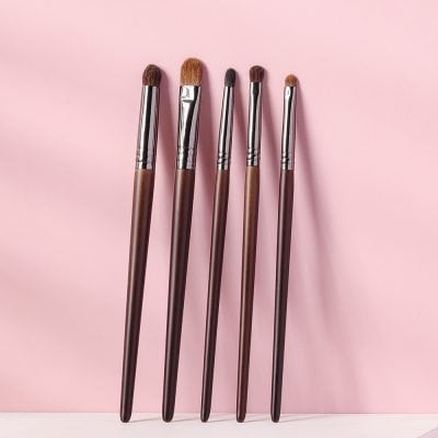 Luxurious makeup brushes set with wooden handles and synthetic bristles for flawless beauty application at Monalisa Store. Perfect for professional and everyday makeup routines.