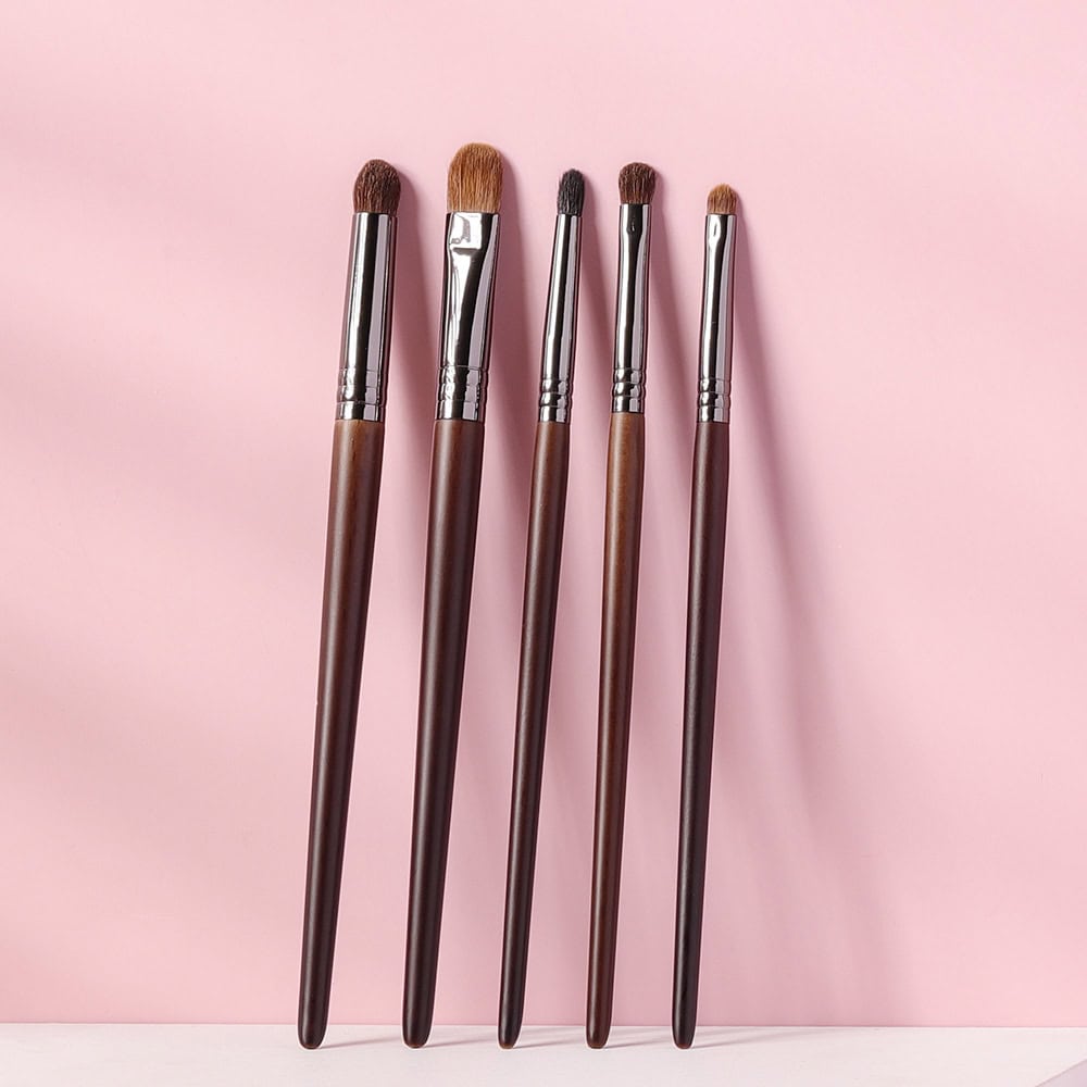 Luxurious makeup brushes set with wooden handles and synthetic bristles for flawless beauty application at Monalisa Store. Perfect for professional and everyday makeup routines.
