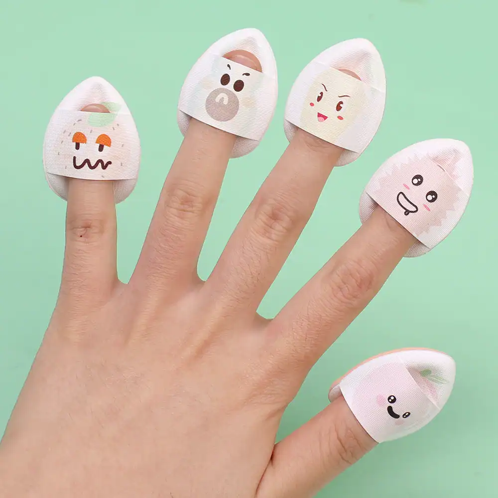 Cute finger bandages with playful cartoon faces, perfect for kids or fun medical care, available at Monalisa Store.