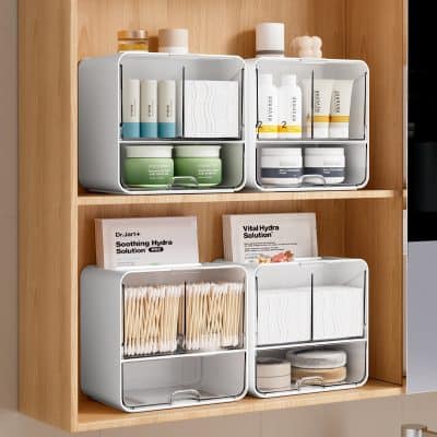 Silicone storage containers for skincare products and cotton pads, organized on wooden shelves at Monalisa Medical store.