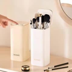 Neat storage containers for makeup brushes and beauty tools on a vanity, featuring minimalist design from Monalisa Store for organized beauty routines.