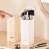 Beauté makeup brush holder storage container, elegant white design for organizing cosmetics and beauty tools.