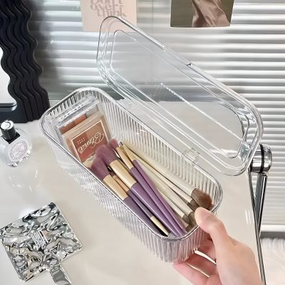 Elegant clear storage box with makeup brushes and cosmetics for skincare and beauty at Monalisa Store. Perfect for organizing beauty essentials and tools.