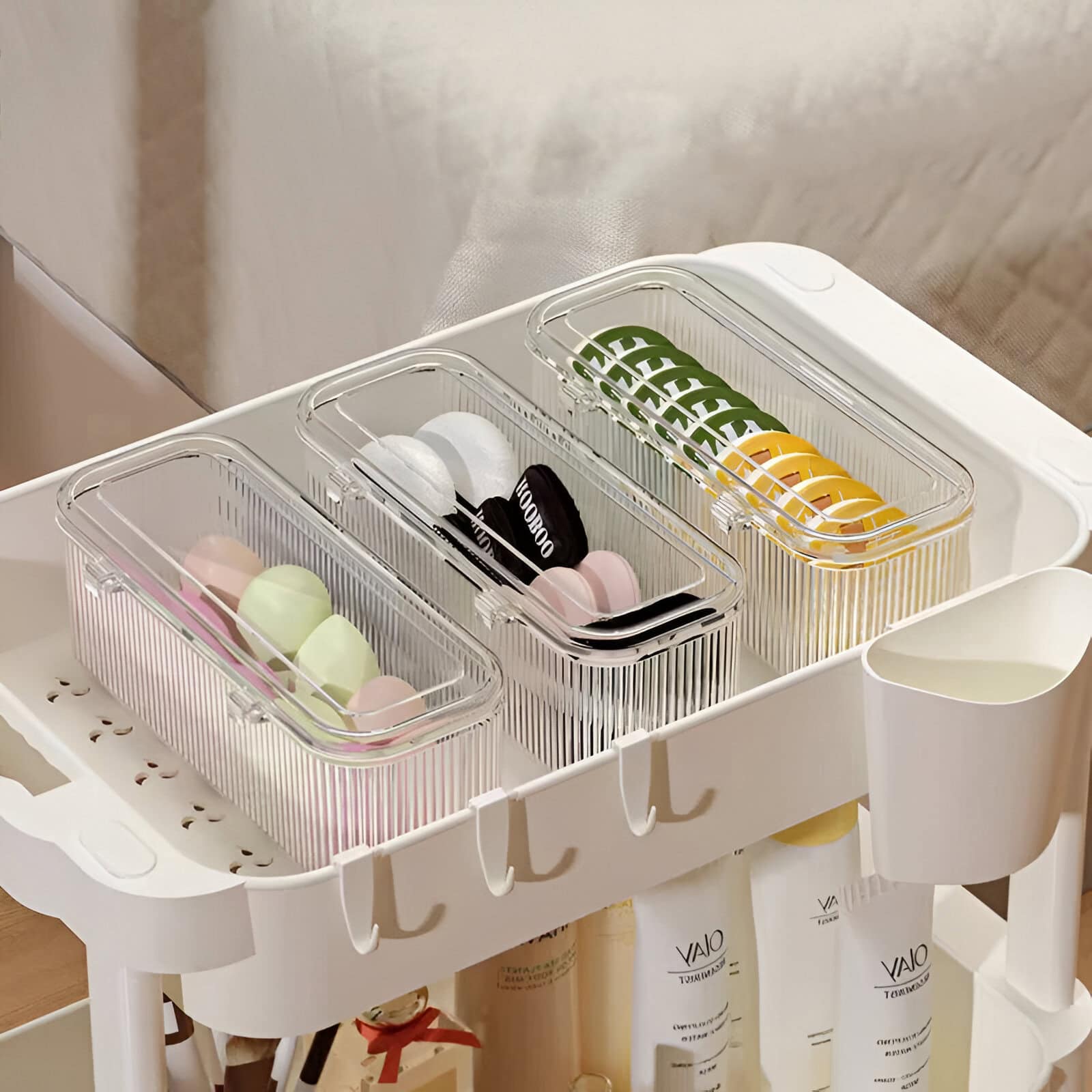 Colorful contact lens cases organized in transparent containers on a white cart at Monalisa Medical Store.