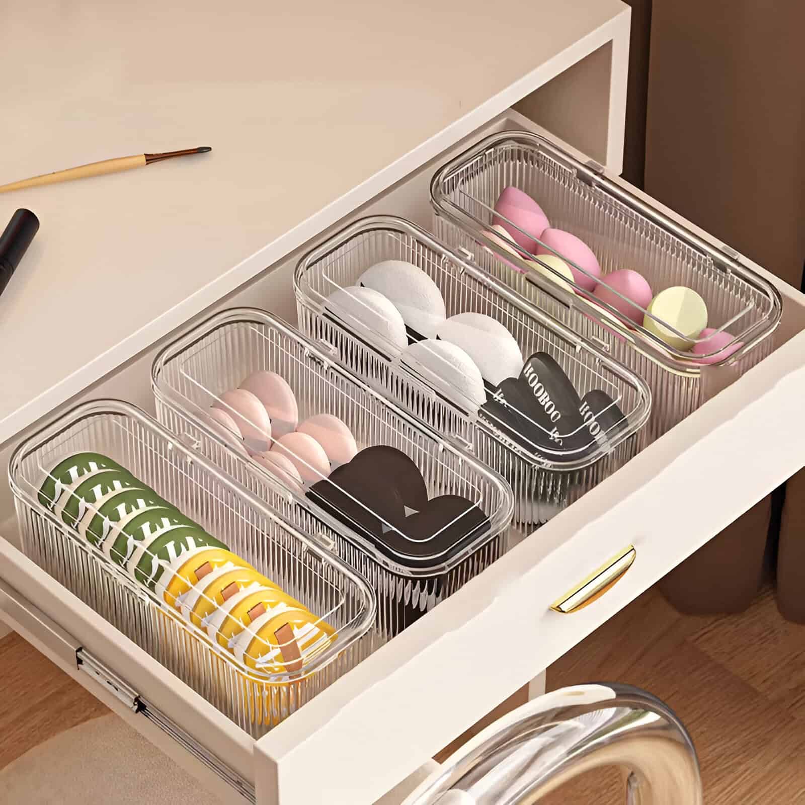 Assorted colorful and black contact lenses stored in clear plastic organizers on a white desk for eye care and vision enhancement at Monalisa Store.
