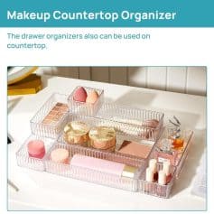 Clear acrylic makeup storage box with multiple compartments for organizing cosmetics, skincare, and beauty tools on a white countertop. Perfect for beauty enthusiasts and makeup lovers.