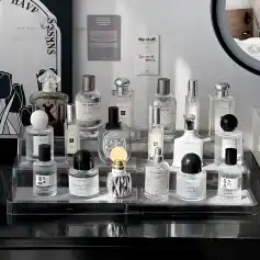 Luxury perfume bottles display at Monalisa Store, featuring designer fragrances and elegant glass containers for sophisticated scent collections.