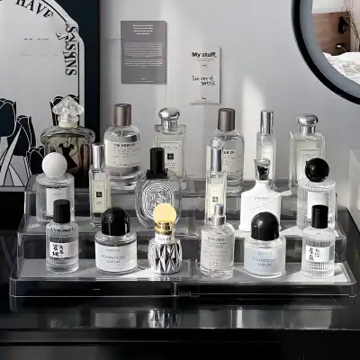 Luxury perfume bottles display at Monalisa Store, featuring designer fragrances and elegant glass containers for sophisticated scent collections.
