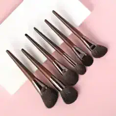 Soft-touch makeup brushes set with brown handles and black bristles, perfect for applying foundation, blush, and contour for a flawless look. Ideal for professional and everyday beauty routines.