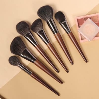 Soft brown makeup brushes set for face and foundation, with a pink blush palette, professional cosmetic tools, and high-quality bristles for blending and contouring.
