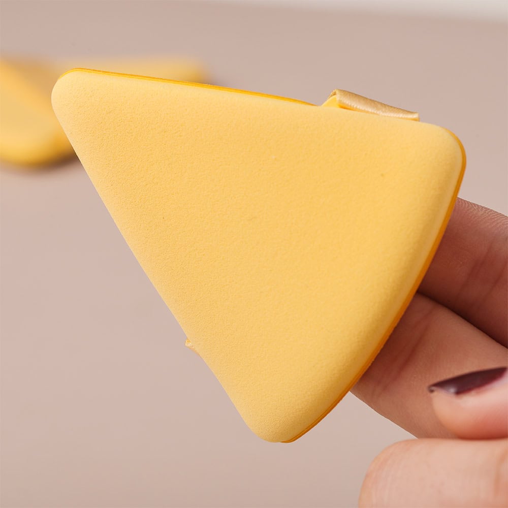 Soft yellow beauty sponge for makeup application, blending, and skincare routine. Ideal for achieving flawless, natural looks with smooth, even coverage. Perfect for professional and personal use.
