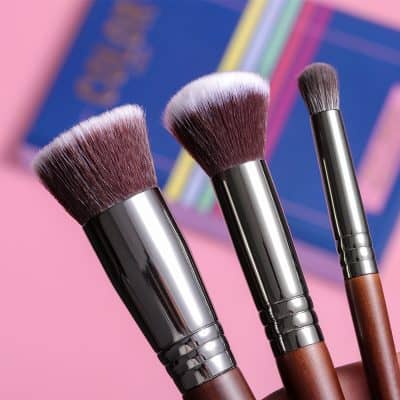 Luxury makeup brushes with wooden handles and synthetic bristles for professional and everyday beauty application.